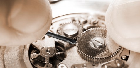 antique pocket watch being repaired ,sepia toned